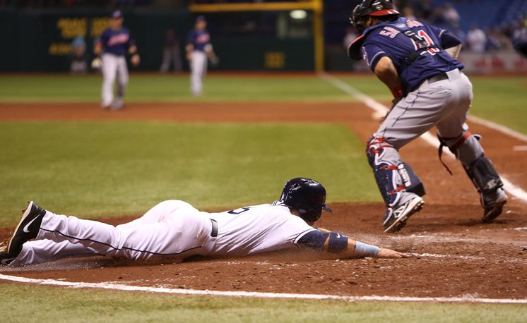 Sam Fuld beats the throw to Indians catcher Carlos Santana on Ben Zobrist’s fifth-inning double. Desmond Jennings also scores on the play, putting the Rays ahead 4-0. (Chris Zuppa/Times)