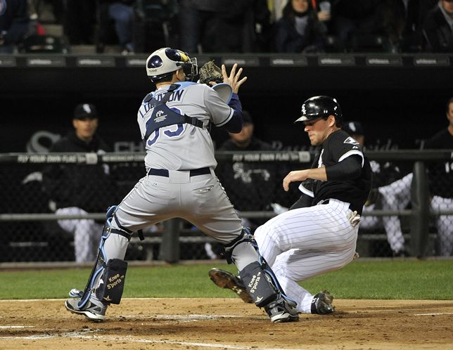 Jose Lobaton prepares to tag out the White Sox’s Conor Gillaspie in the fourth inning. (Photo courtesy of Getty Images)