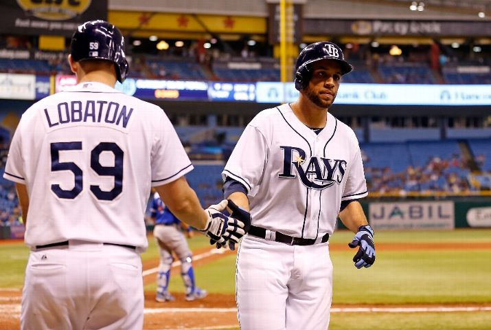 James Loney  is congratulated after scoring a run against the Toronto Blue Jays. (Photo by J. Meric/Getty Images)