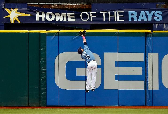 Sam Fuld makes a catch at the top of the wall against the San Diego Padres. (Photo by J. Meric/Getty Images)