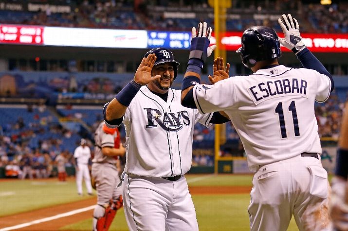 Yunel Escobar and Jose Molina celebrate after scoring in the fourth inning against the Boston Red Sox. (Photo by J. Meric/Getty Images)