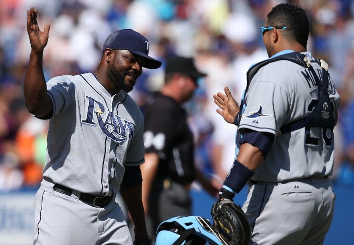 Fernando Rodney celebrates their victory with Jose Molina during the game against the Toronto Blue Jays Saturday. (Photo by Tom Szczerbowski/Getty Images)