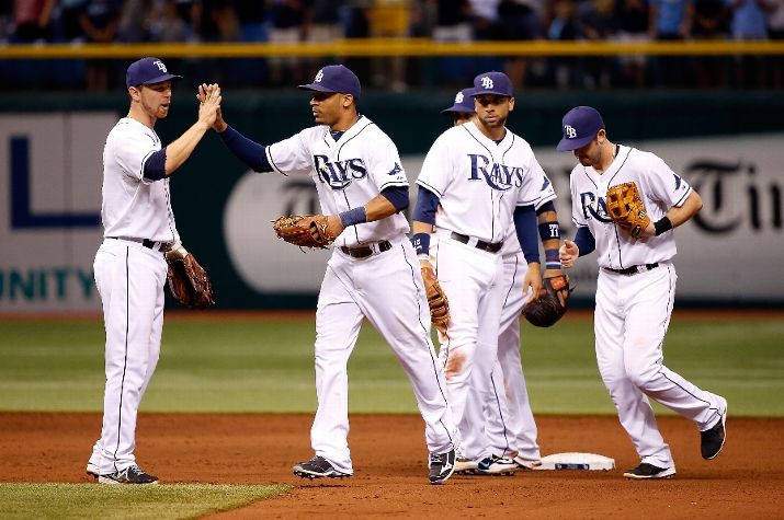Teammates congratulate Desmond Jennings of the Tampa Bay Rays after the Rays victory over the Houston Astros. (Photo by J. Meric/Getty Images)