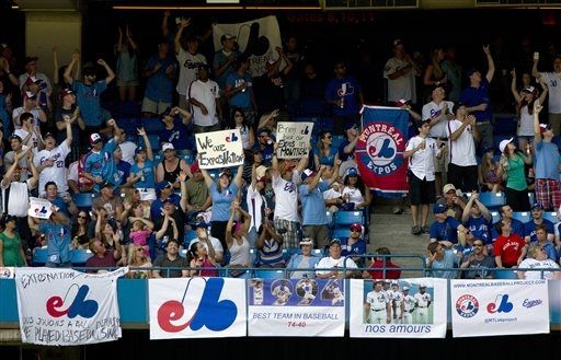 Montreal Expos fans fill an outfield section during a baseball game between the Tampa Bays Rays and Toronto Blue Jays Toronto on Saturday July 20, 2013. The Montreal fans hope to lure a major league team back to their city. (AP Photo/The Canadian Press, Frank Gunn).Now it all makes sense. Cough...I certainly hope they’re not implying the Rays would be the team lured back to Montreal.