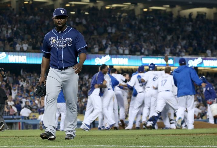 Fernando Rodney walks off the fielder after giving up four runs in the ninth inning to lose the game. The Dodgers won 7-6. (Photo courtesy of Stephen Dunn/Getty Images)