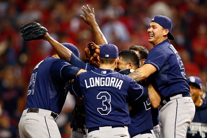 Evan Longoria celebrates with his teammates after defeating the Cleveland Indians in the American League Wild Card. (Photo by Jared Wickerham/Getty Images)
