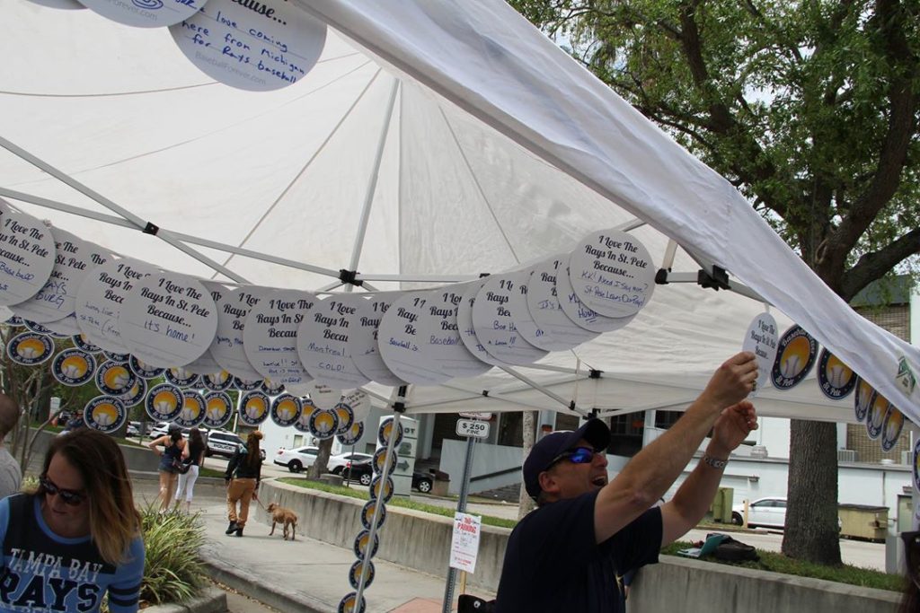 Mayor Rick Kriseman worked the 'Baseball Forever' tent on Opening Day.