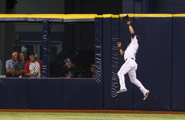 Kevin Kiermaier makes the catch on a long flyball by Baltimore Orioles left fielder Nolan Reimold in the eighth inning of a game in July at Tropicana Field. (Photo Credit: Will Vragovic/Tampa Bay Times)